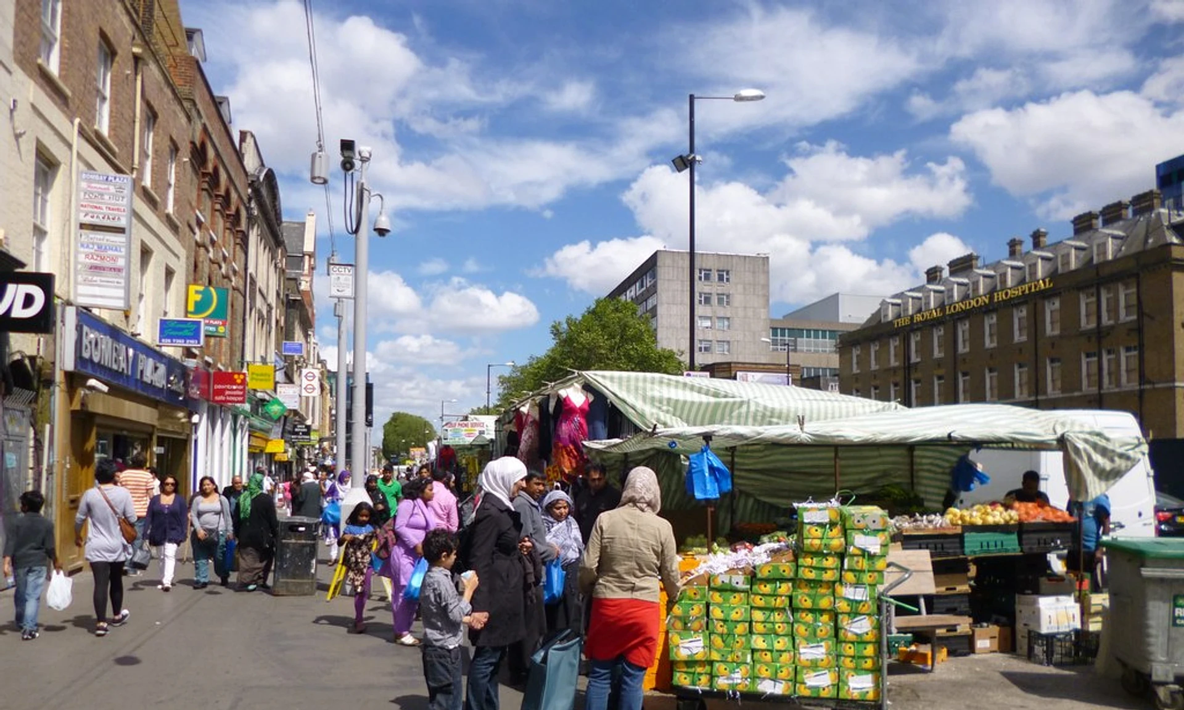 Market stalls and shoppers along Whitechapel Road